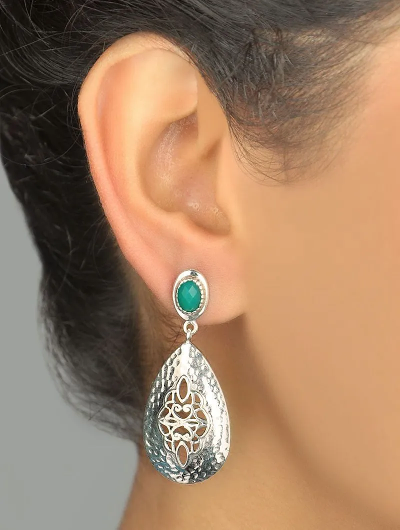 Exquisite, jali work and hammer finish earrings accented with green stone
